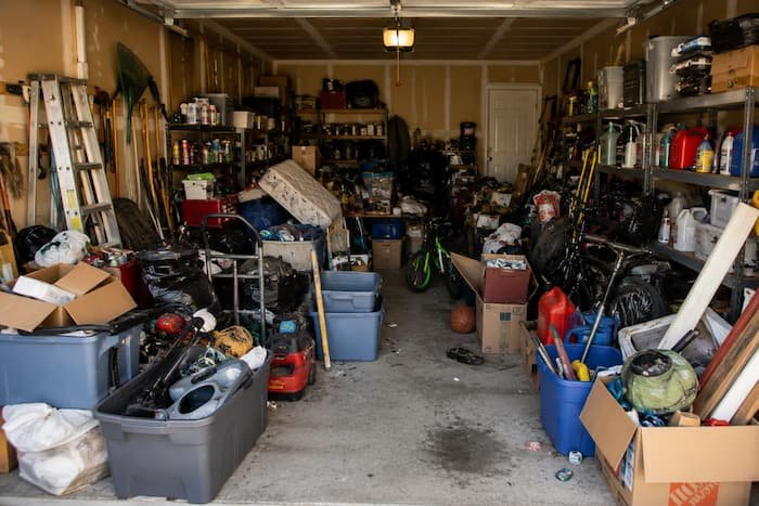 very cluttered garage with no room to move around.